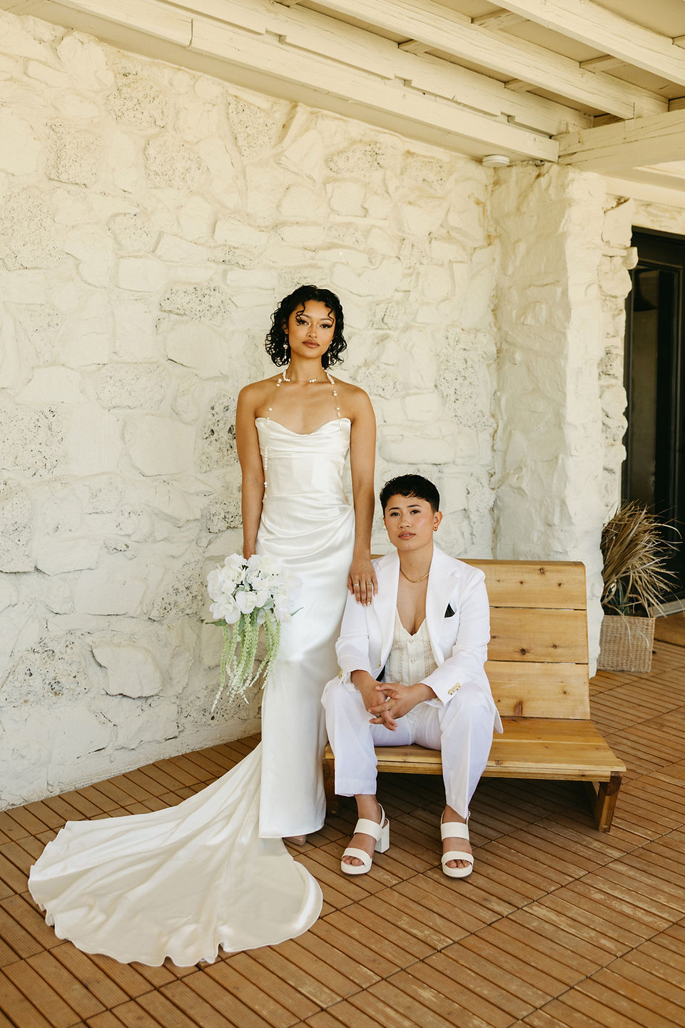 lesbian brides wearing all white at nxwhere california joshua tree wedding