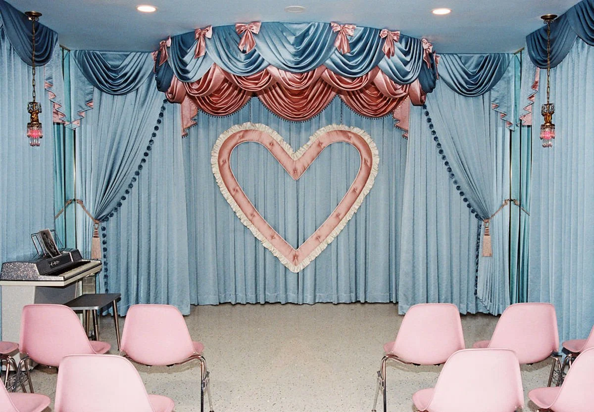 giant pink heart against blue backdrop at sure thing chapel las vegas wedding chapel