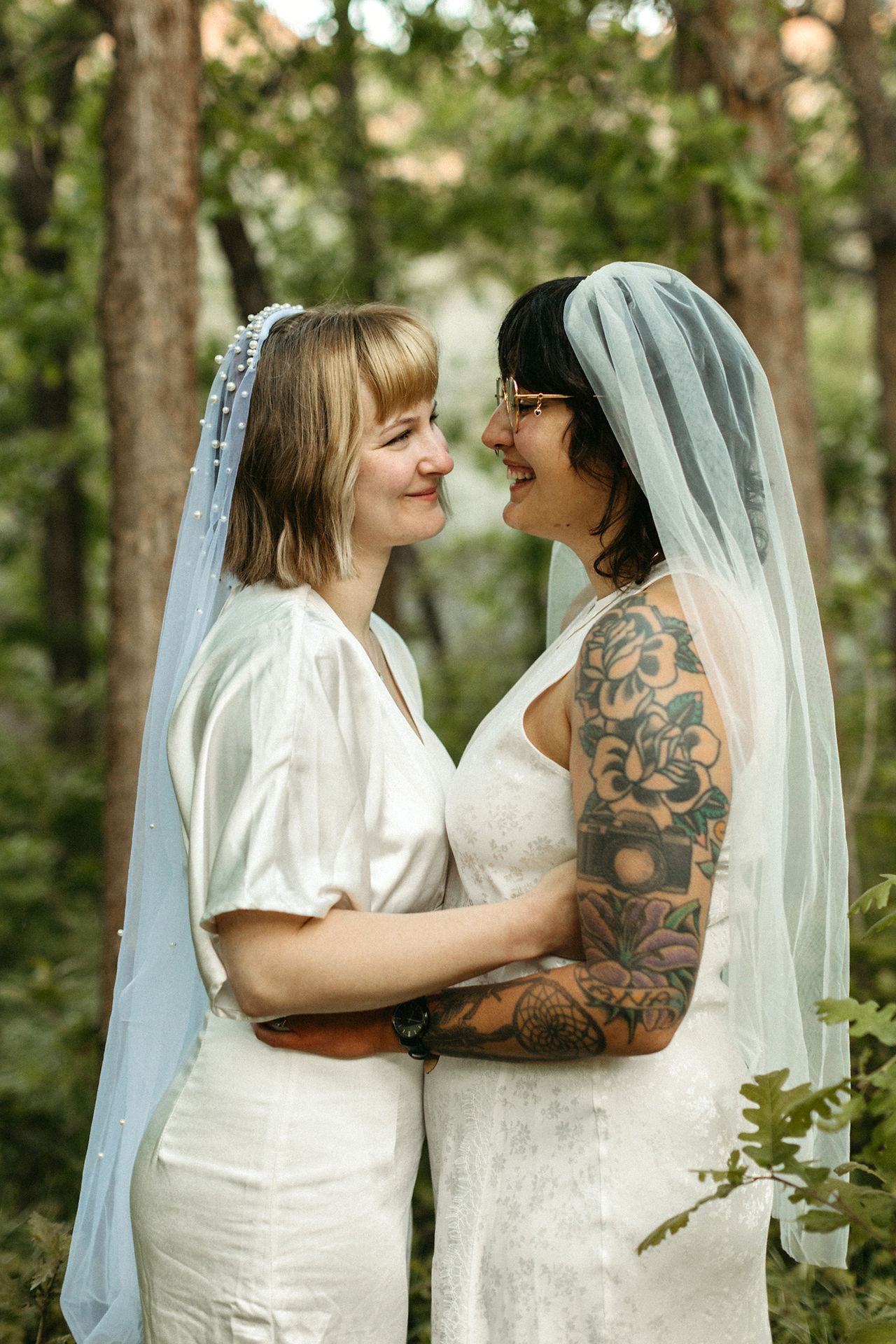 two brides under trees during zion national park elopement