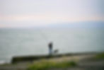 Person Relaxing by the Water