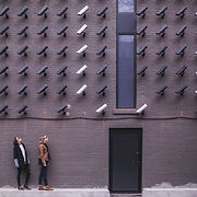 two-person-standing-under-lot-of-bullet-