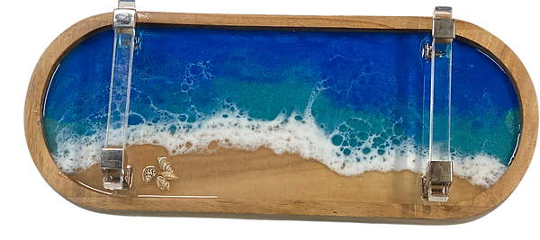 Ocean themed resin wood tray. Small shells adorn the tray.