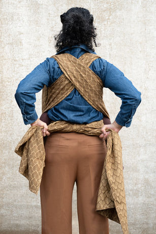 Bring it to the back and tie it off