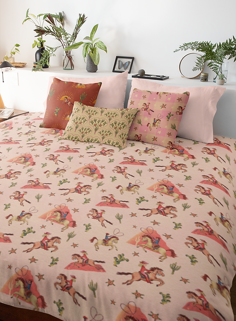 Mock up of the patterns from Wild Country showing a gorgeous duvet set with cushions - available for licensing