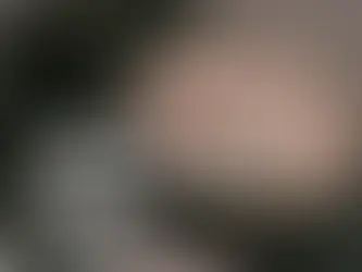 lose-up of a camera mode dial showing settings like "AUTO," "SP," and "M."