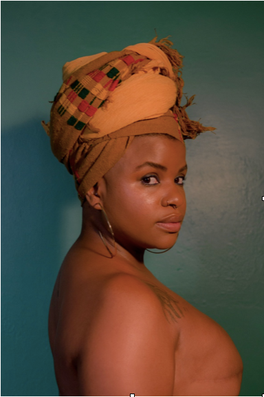Ericka Hart poses nude against a teal background
