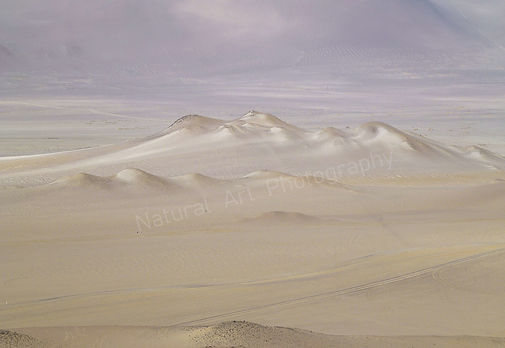 An icredible ethereal view over the protected desert region of Ica in the Paracas National Reserve near Ballestas Islands