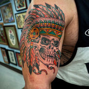 Traditional Skull Native American Headdress Tattoo on Upper Arm