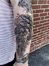 Fineline illustrative blackwork realistic pinecone on the front bicep. Done by Jon Gorman.