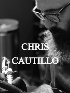 Chris Cautillo tattooing holding a tattoo machine