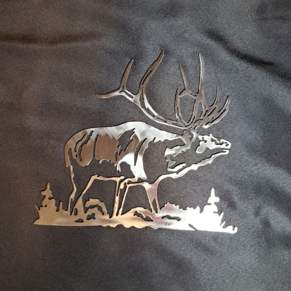 raw metal under clear coat. grass at feet. open cuts to show lines of art