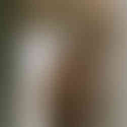 Two brieds have just come back in from the rain and are smiling foolishly at the camera.