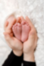 close-up-baby-feet-mothers-hands.jpg
