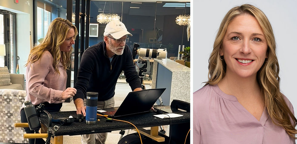 Employee reviewing a newly captured headshot with the photographer beside the finished professional business portrait.