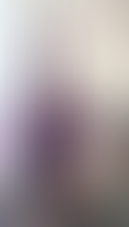woman with a fuller bust doing inverted yoga posture in a supportive bra free top
