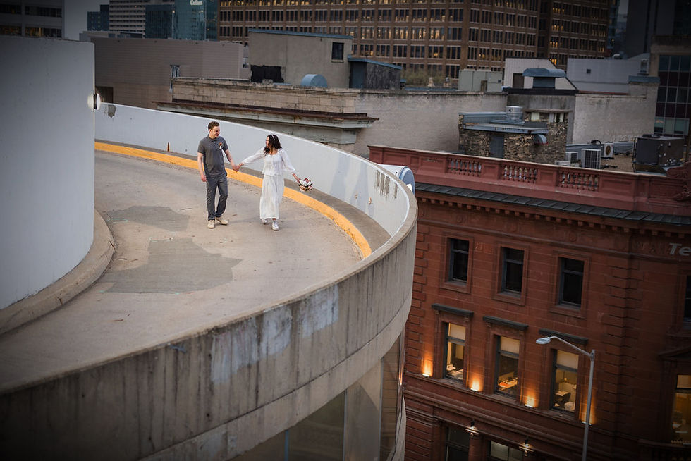 Couple during an intimate rooftop elopement ceremony in Winnipeg