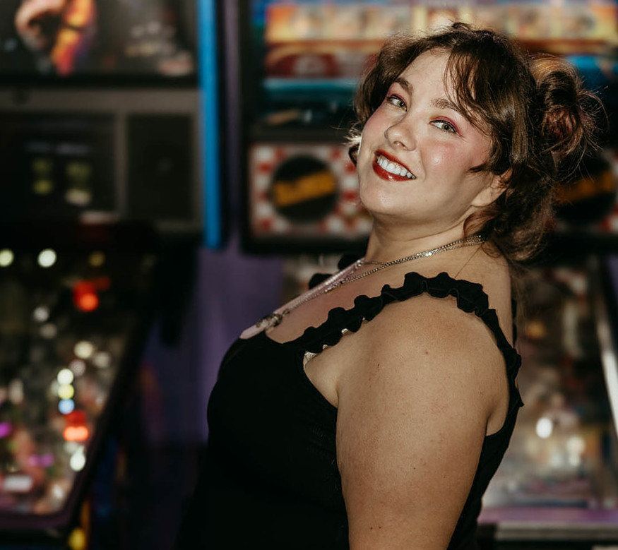 Jessi, Chaos Magic Skates, a brown haired green eyed woman. A former derby skater turned dance skater