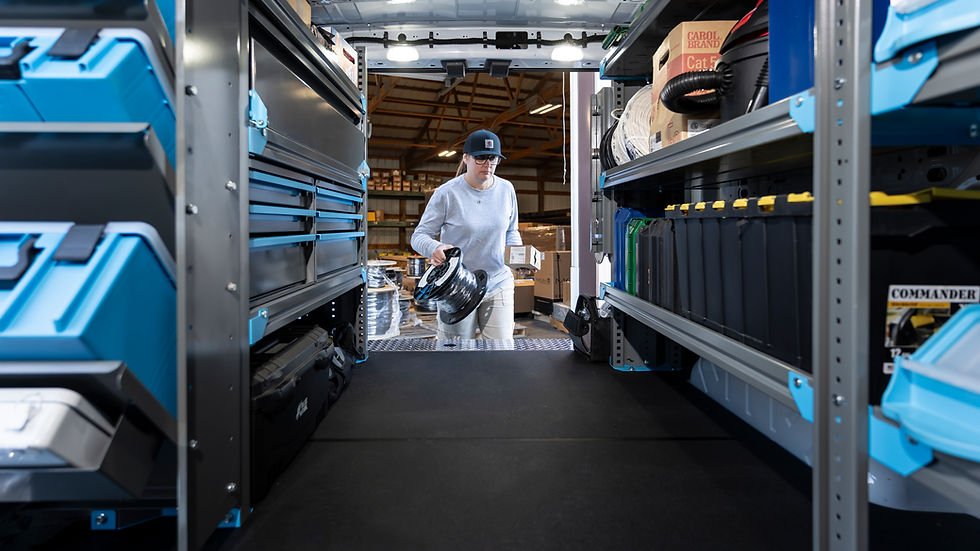 High angle view of a technician installing truck shelving