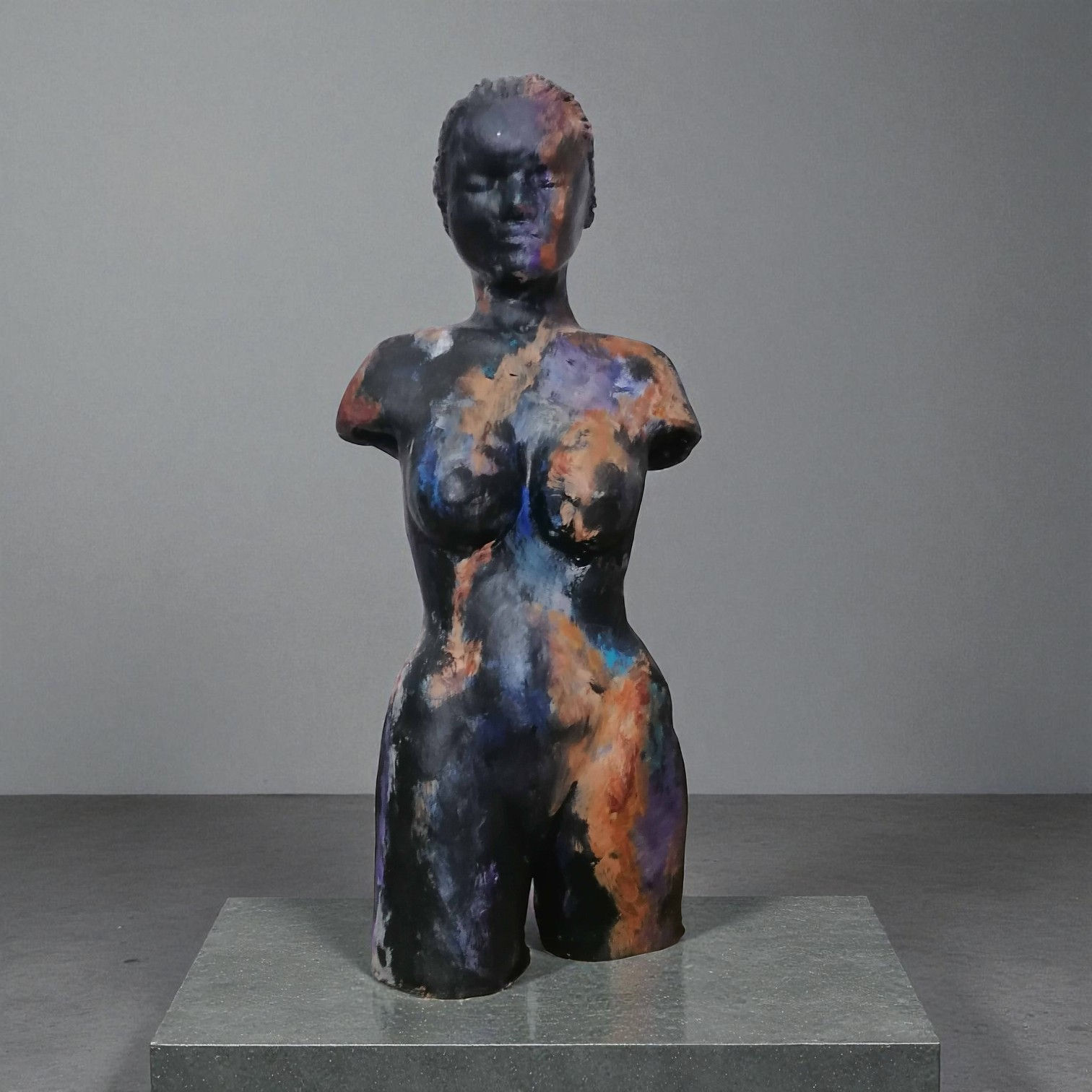 Woman, sculpture made in clay and painted with an abstract pattern