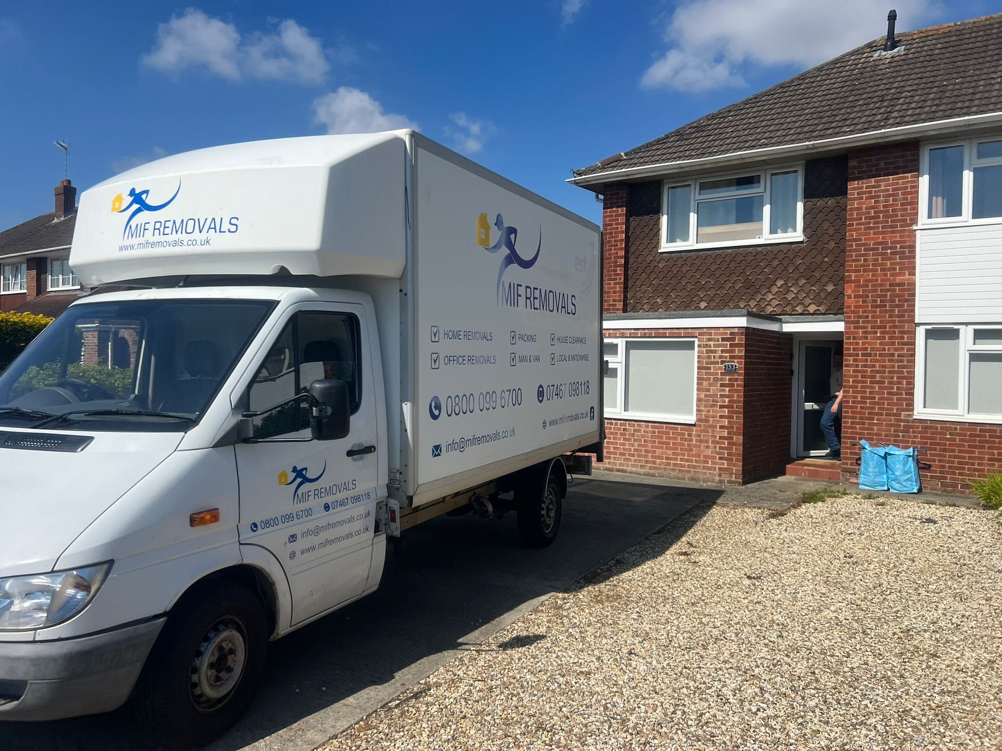 MIF Removals van parked outside an office building ready for business relocation services