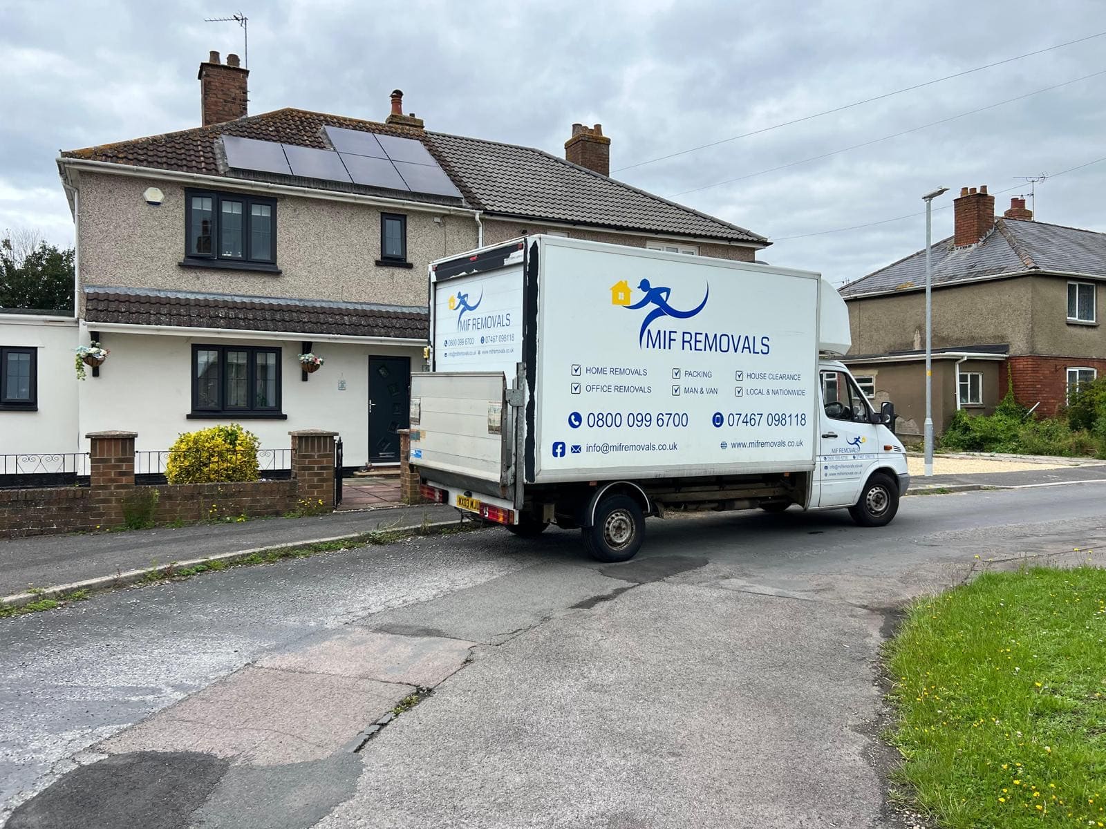 Experienced office movers from MIF Removals organizing boxes and furniture during a commercial move