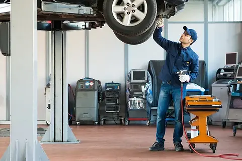 depositphotos_67063213-stock-photo-mechanic-at-work-in-his.jpg