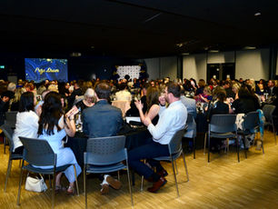 A room full of people at an event.