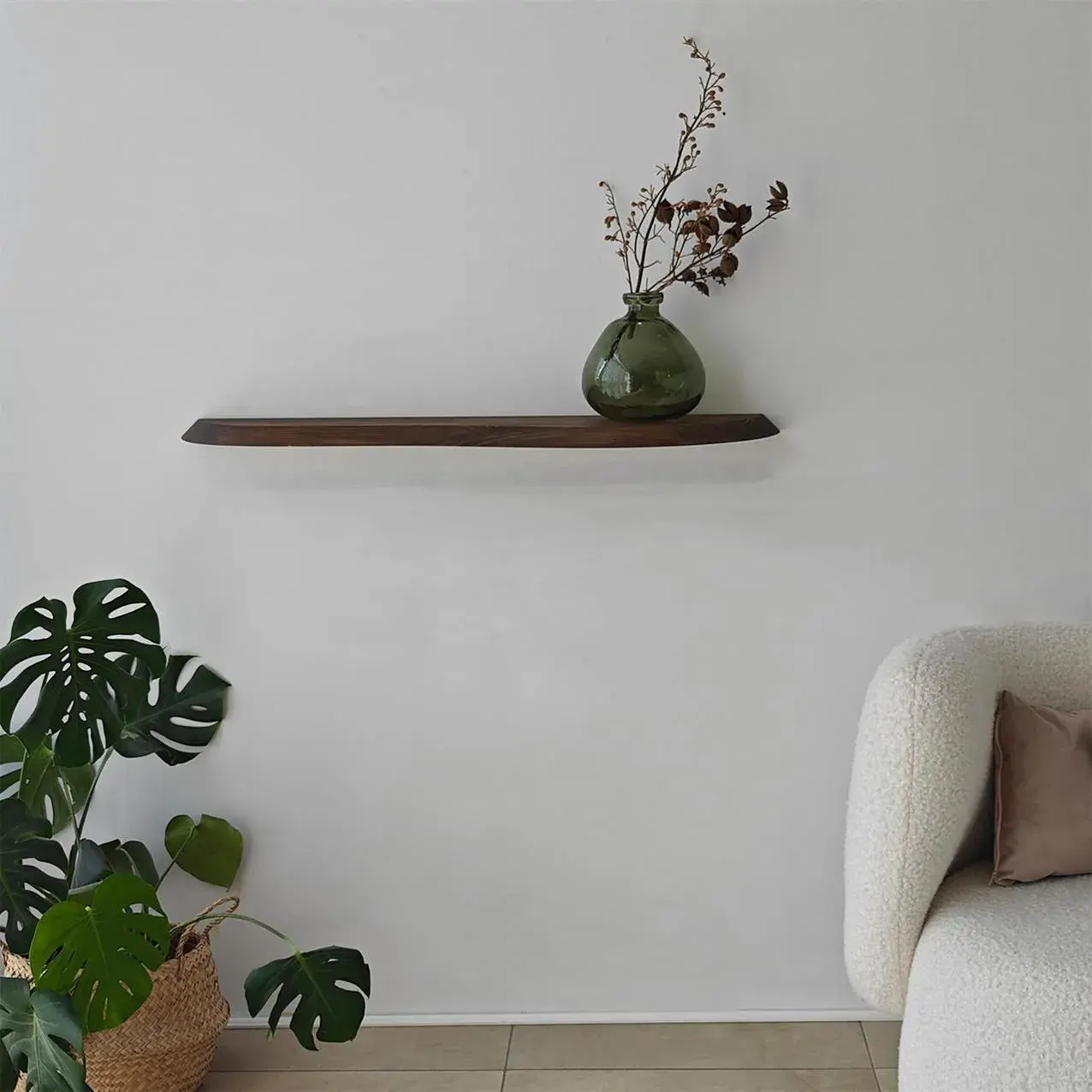 Minimalist living room setting with Wavy shelf holding decor items