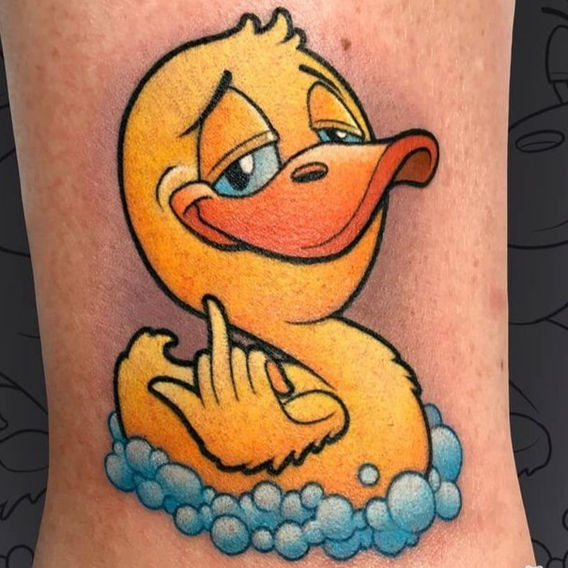 Color new school tattoo of a yellow duck giving the middle finger by Connecticut tattoo artist Cracker Joe.