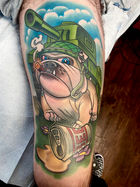 New school color leg tattoo of a bulldog wearing an army hat, smoking a cigar and stepping on a can of beer standing in front of a tank created by Cracker Joe Swider at Skin Deep Ink Tattoo shop in New Milford, CT