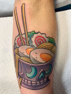 new school color tattoo of a bowl resembling a skull filled with ramen noodles, hard boiled eggs, and chopsticks on a calf created by Cracker Joe Swider working in the Danbury, CT area