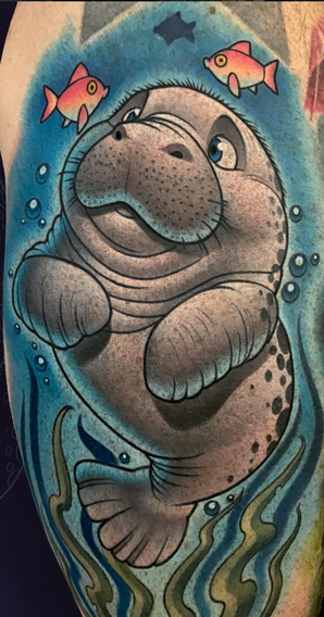 New school color manatee tattoo with flowing water background by Joe Swider in New England