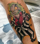 New school color tattoo of Beetlejuice in his striped suit with bold horror-inspired detail by Joe Swider in Connecticut