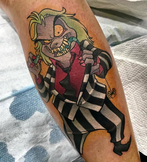 New school color tattoo of Beetlejuice in his striped suit with bold horror-inspired detail by Joe Swider in Connecticut