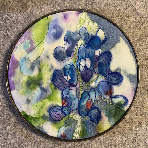 art quilt featuring a bluebonnet in a six inch vintage metal embroidery hoop