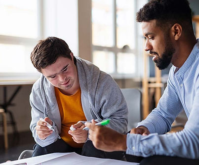 man working with disabled client