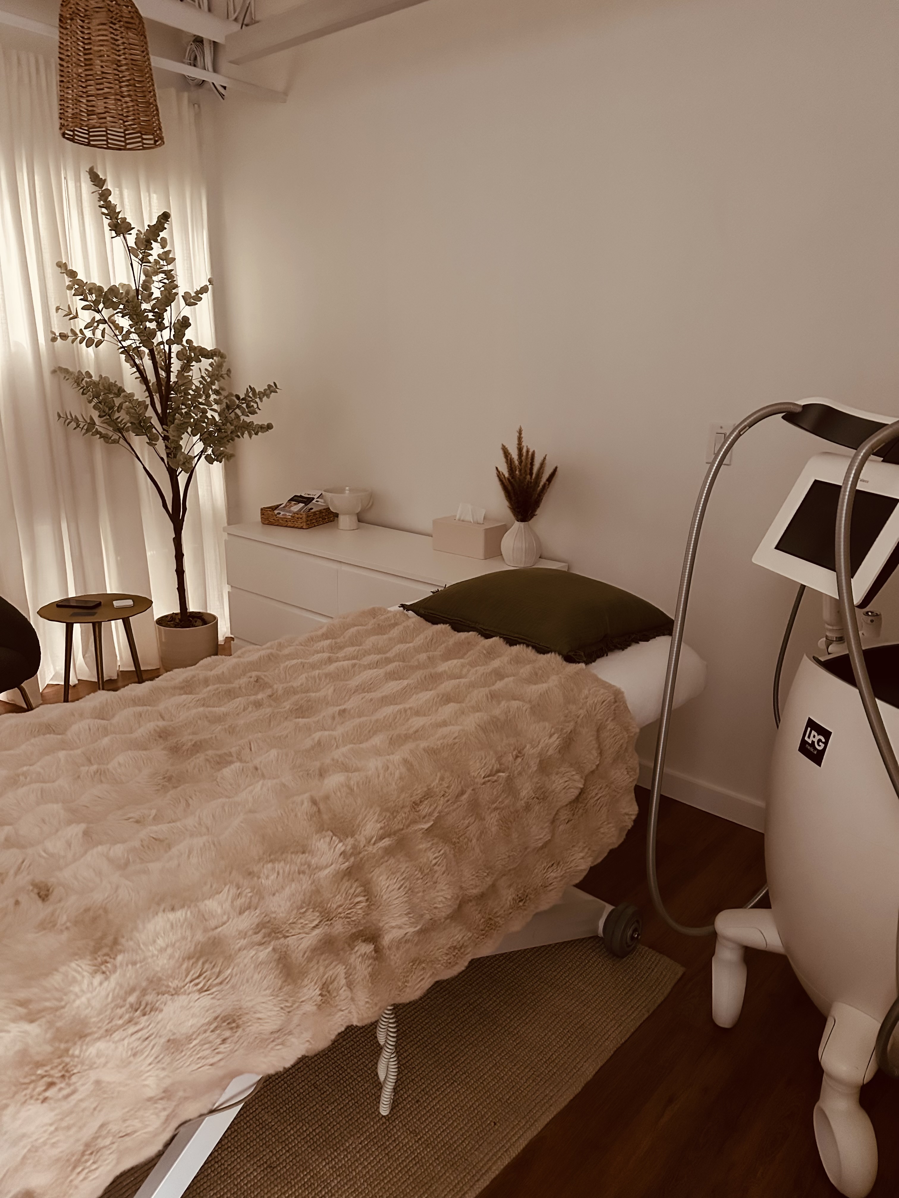 Close-up of a professional LPG body treatment device in a clean spa setting.