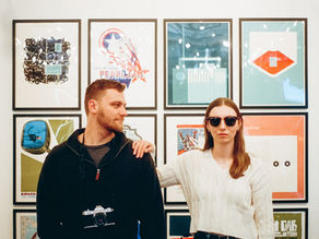 Wes Anderson inspired engagement photos on film - dive bar, record collection, and coffee shop