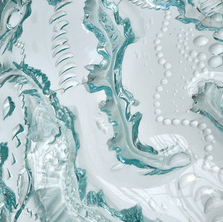 glass art installation close-up of textured blue and white glass artwork