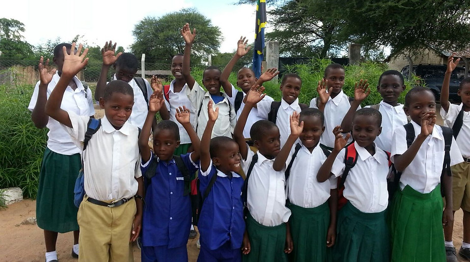 Smiling children at Mayega Children’s Center in Tanzania, supported through Shrike Safaris’ 360° Impact Safari program.