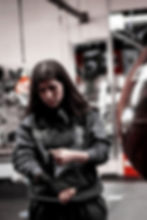 female athlete applying hand wraps