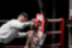 coach helping a boxer recover