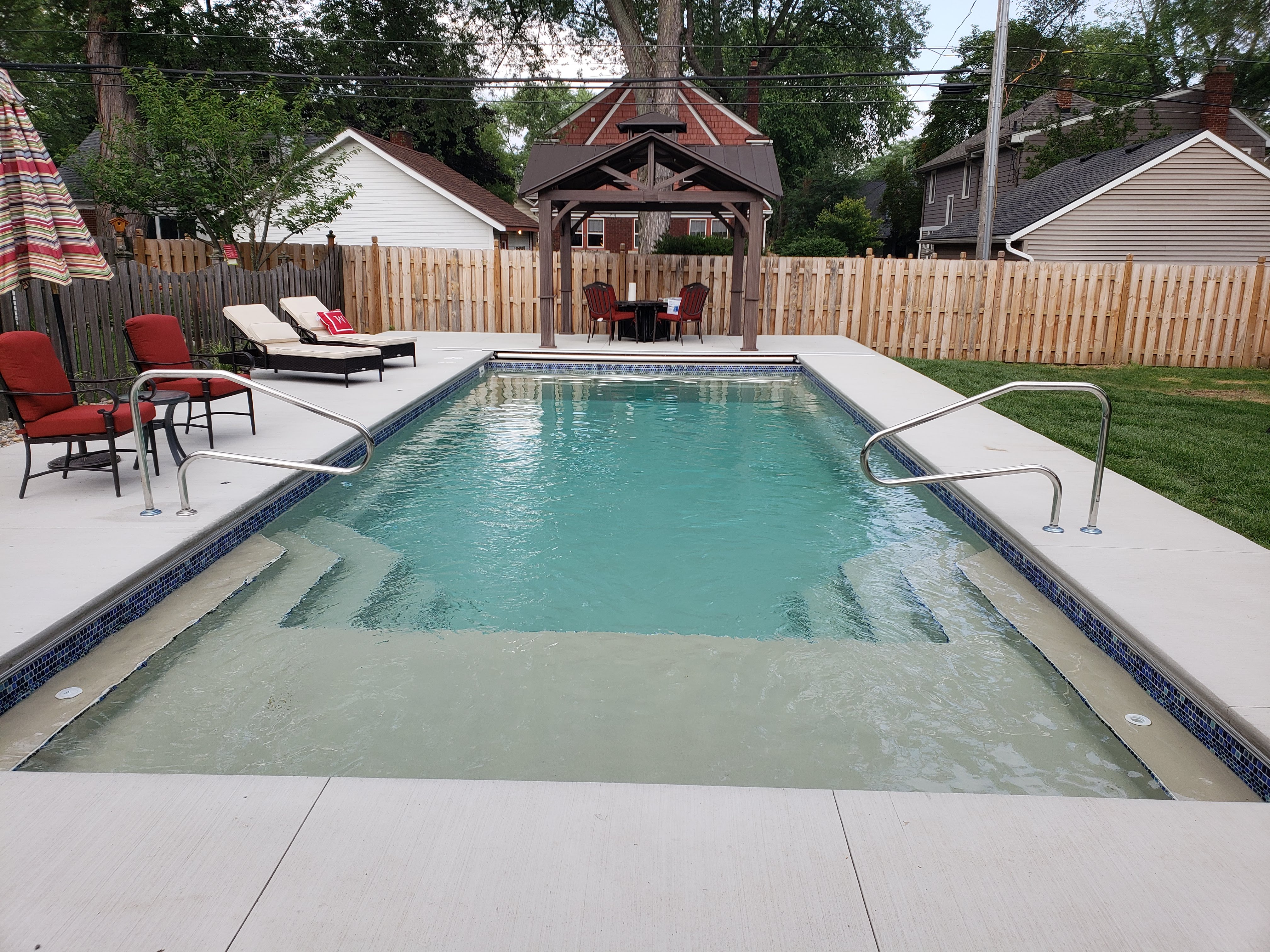 rectangle pool with tanning ledge