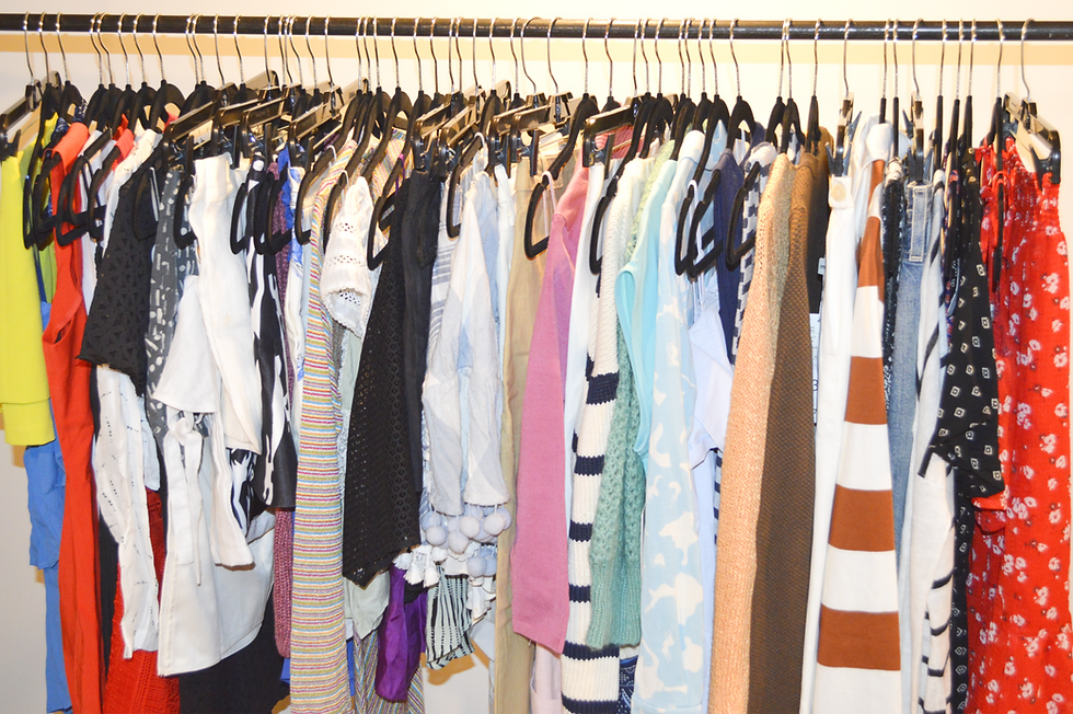 Eye-level view of a vintage shop displaying colorful clothing