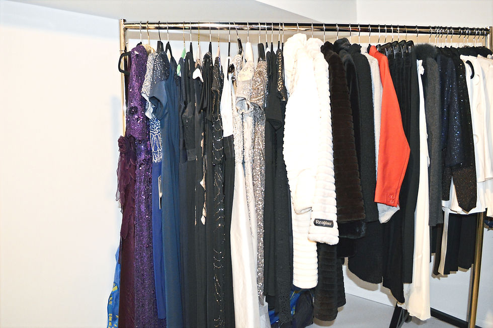 Eye-level view of a vintage boutique showcasing classic dresses