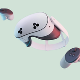 A white Meta Quest headset with two white controllers.