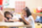 Young girl laughing in class