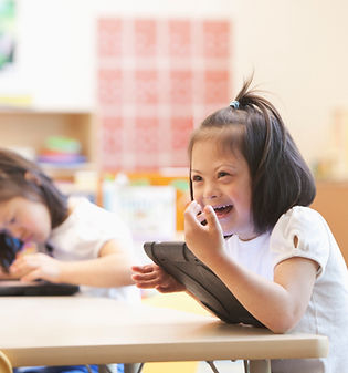 neurodivergent children learning in a group setting.