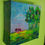 Thumbnail: small red trees near a green forest painting