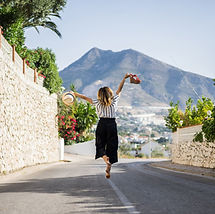 young-beautiful-woman-vacation-jumping-o